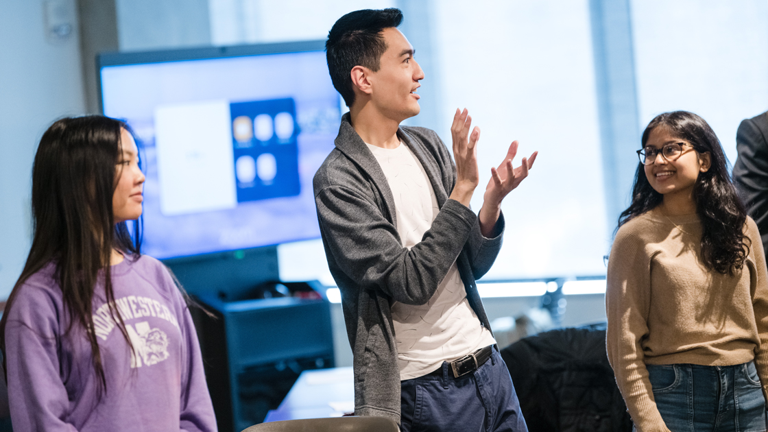 Students handing each other note cards