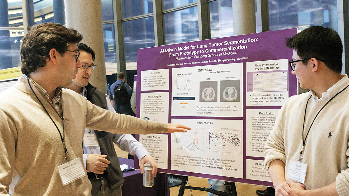 Hamilton Murrah and team in front of poster