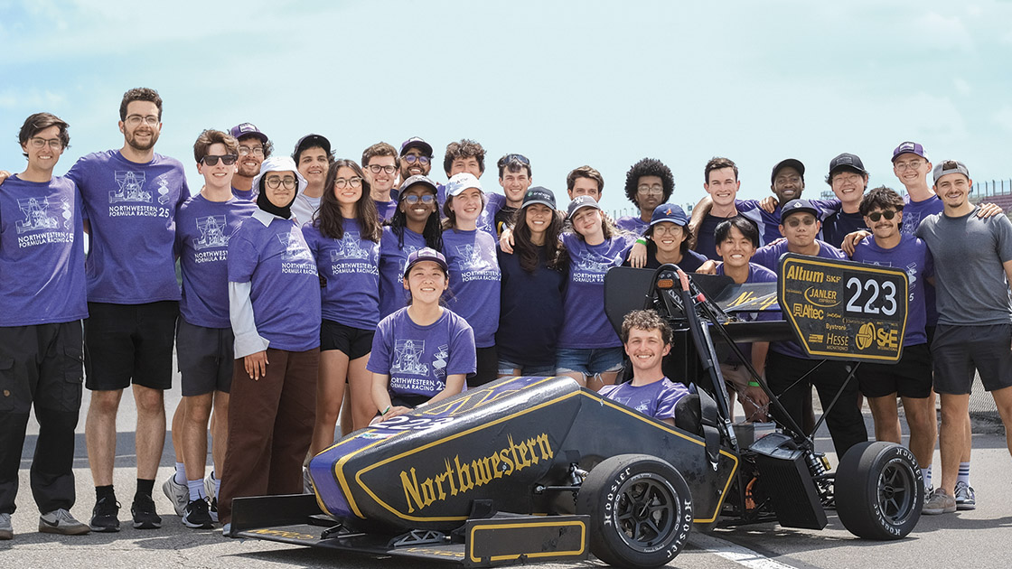 The Northwestern Formula Racing Team at the June 2025 Formula SAE Electric competition at Michigan International Speedway. Pictured left to right: (rear row) Drake Vogelpohl, Benji Sobeloff-Gittes, Lance Locker, Evan Bertis-Sample, Arda Noyan Kacar, Cam Estrada, Yassine El Haboussi, Ben Smith, Ryan Boyle, Oliver Dominguez-Holler, Matias Ketema, Aidan Gregoire, Danish Galebotswe, Ryan Chung, Anton Walvoord, Matt Hosemann; (middle row) Marah Taqatqa, Cheresa Turek, Rahwa Tesfay, Anna Murray, Carol Klingler, Nil Ozcevik, Jason Lin, Nathan Lee, Du Chen, Matt Martinez; (front) Stella Heo, Charlie Seifert | Photo by Jason Lin